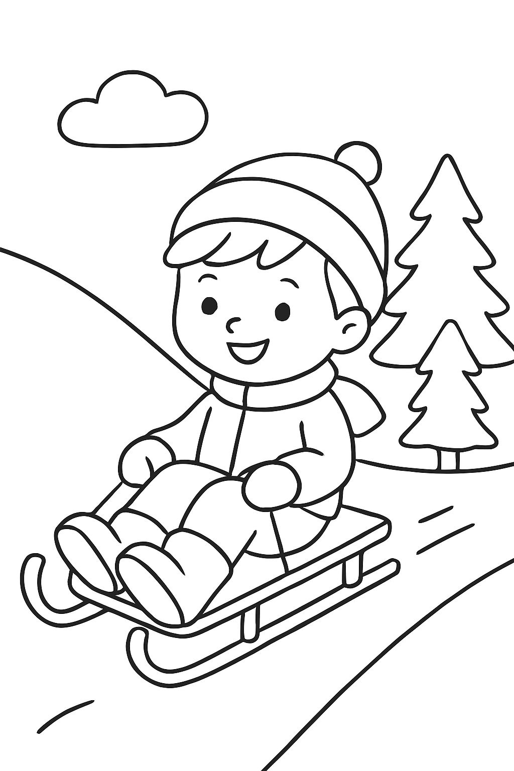 3 year old boy sledding down a snowy hill