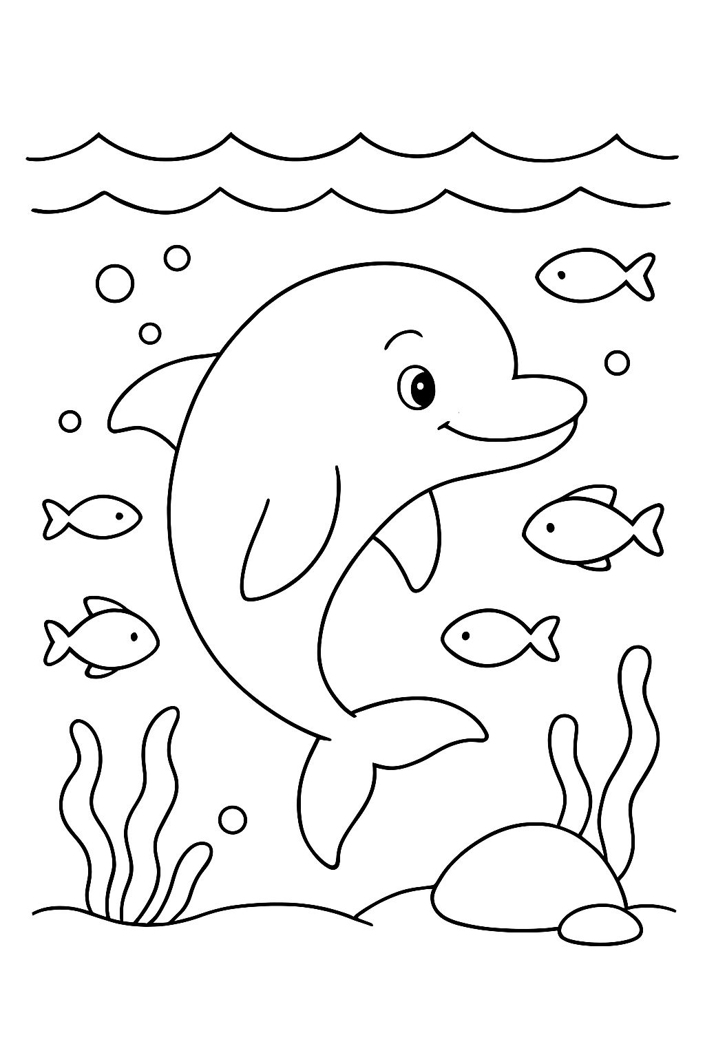 A dolphin swimming under the surface surrounded by fish